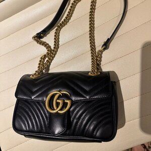 The Gucci Marmont flap bag in black is absolutely gorgeous, practically brand ne